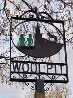 Woolpit Village Sign, Depicting the Green Children